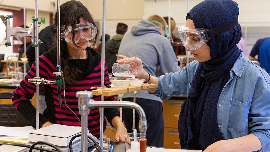 Two students working in a lab on campus