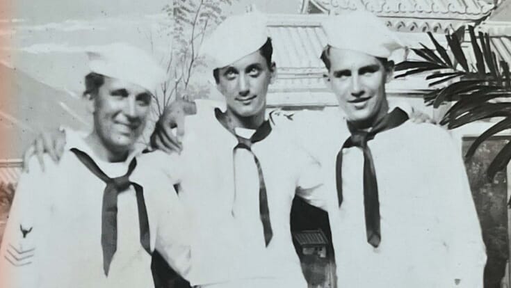 black and white photo of three navy sailers